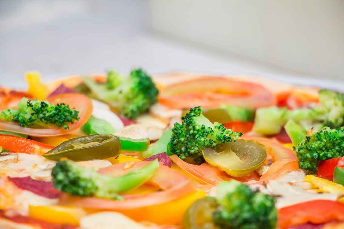 Healthy Pizza for fitness with broccoli and basil